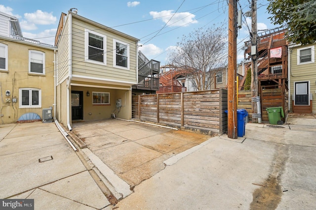 exterior space featuring cooling unit and a lanai