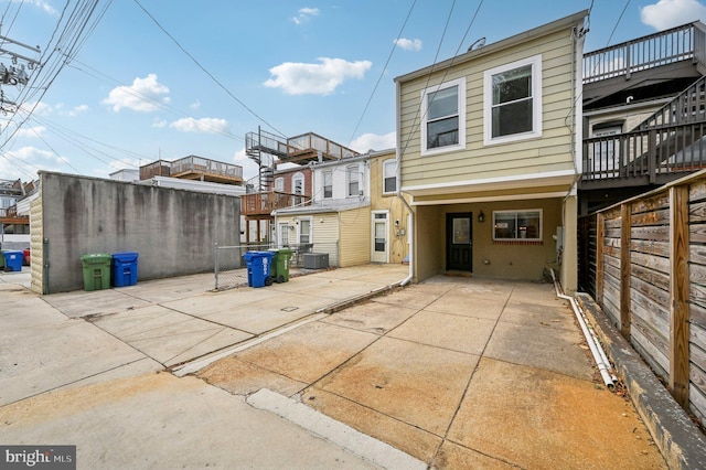 back of property with central AC unit