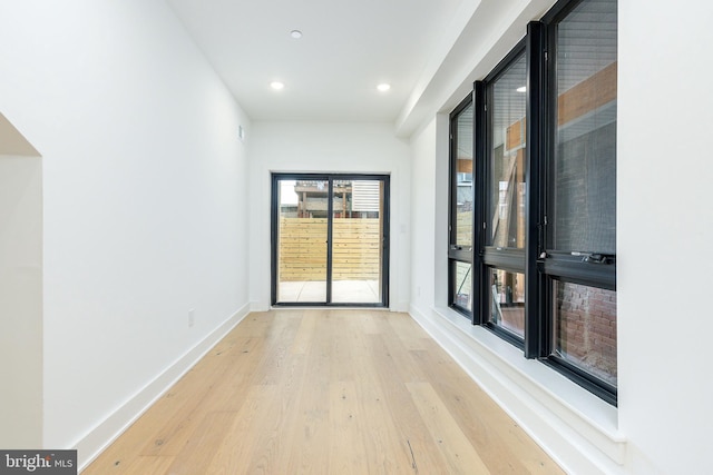 spare room featuring light hardwood / wood-style flooring