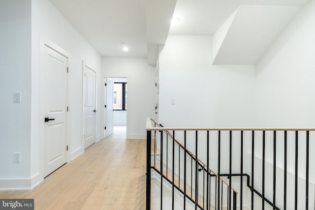 corridor with light wood-type flooring