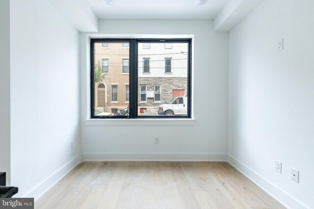 spare room featuring light hardwood / wood-style floors