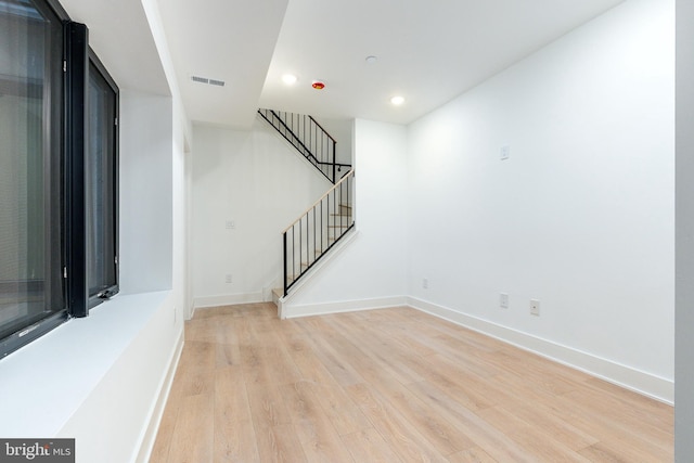 spare room featuring light hardwood / wood-style floors