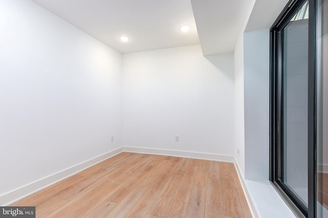 spare room featuring light wood-type flooring