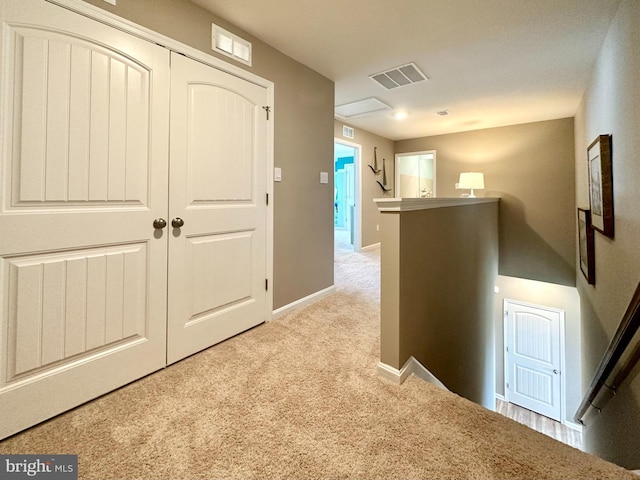 hallway with light carpet