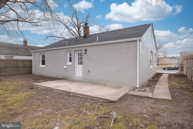 rear view of house featuring a patio