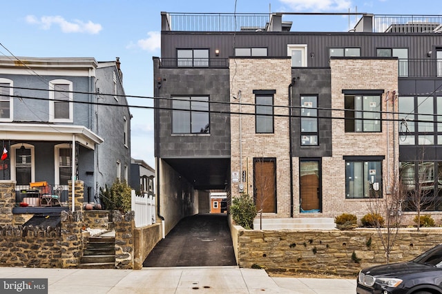 view of property with brick siding