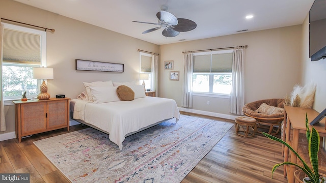 bedroom with hardwood / wood-style flooring and ceiling fan