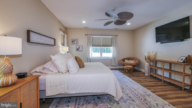 bedroom with dark wood-type flooring and ceiling fan