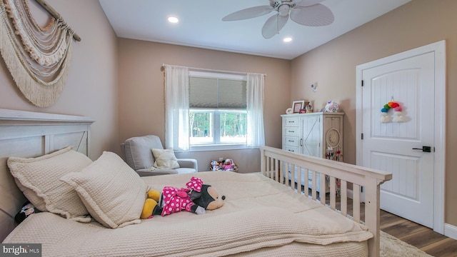 bedroom with hardwood / wood-style flooring and ceiling fan