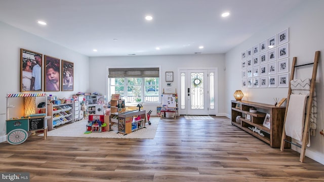 game room with wood-type flooring