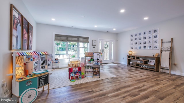 game room featuring hardwood / wood-style floors