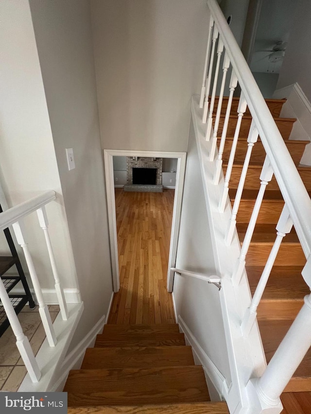 stairway with hardwood / wood-style floors