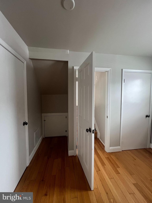 corridor featuring hardwood / wood-style flooring