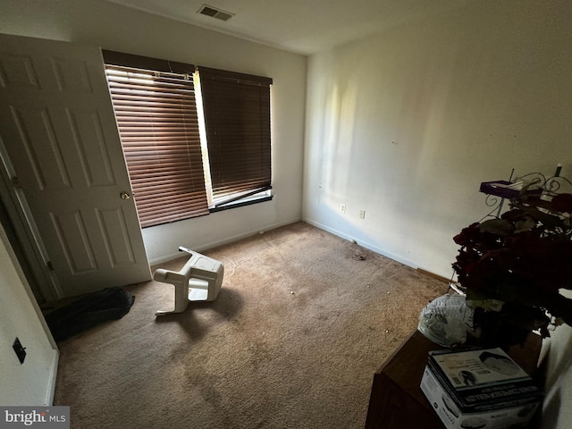 unfurnished bedroom featuring light carpet