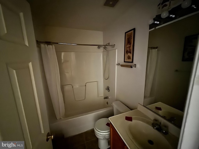 full bathroom with vanity, tile patterned floors, toilet, and shower / bath combo with shower curtain