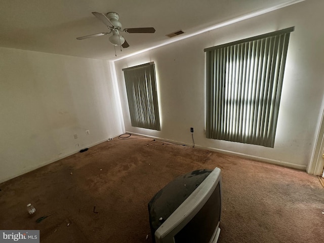 carpeted empty room with ceiling fan