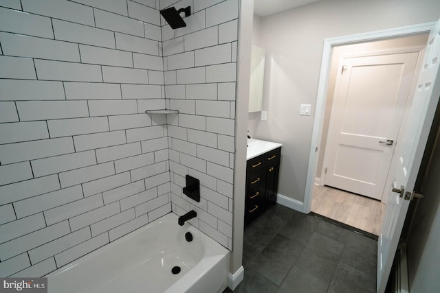 bathroom with vanity and tiled shower / bath