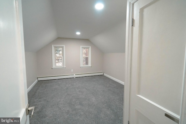 bonus room featuring lofted ceiling, carpet, and baseboard heating