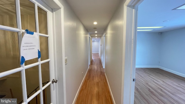 corridor featuring light hardwood / wood-style floors