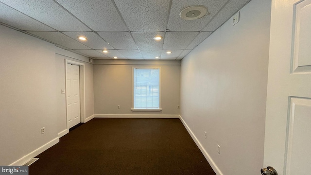 spare room with a paneled ceiling