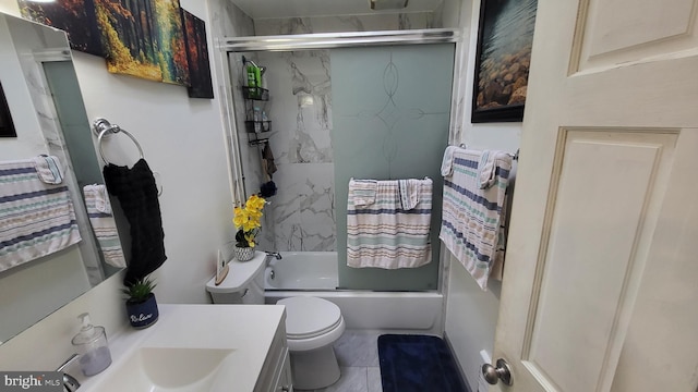 full bathroom featuring toilet, vanity, and bath / shower combo with glass door