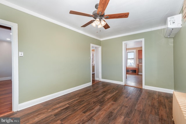 spare room featuring crown molding, ceiling fan, dark hardwood / wood-style flooring, and radiator