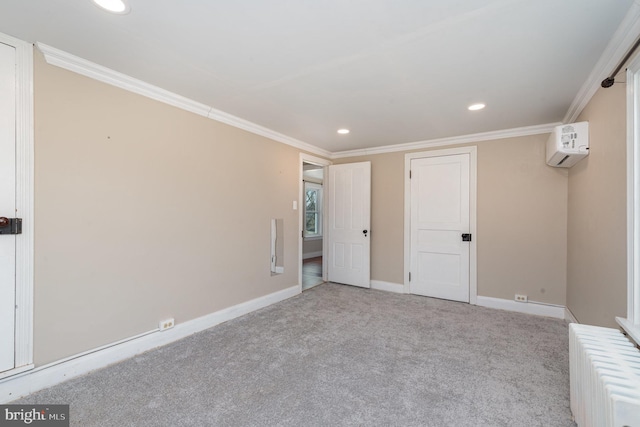 unfurnished bedroom featuring crown molding, a wall unit AC, and light colored carpet