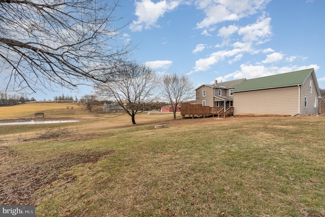 view of yard featuring a wooden deck