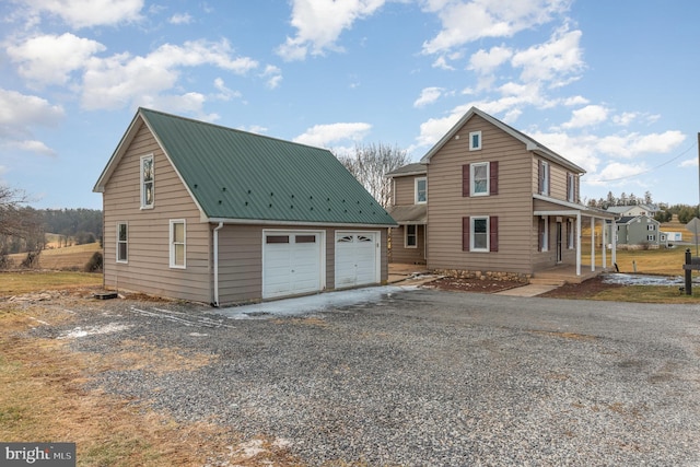 view of front of house with a garage and covered porch