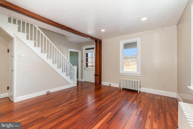 interior space with radiator and dark wood-type flooring