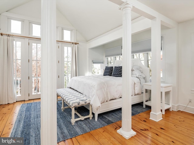 143 Market St, Annapolis, MD 21401 - bedroom featuring access to outside, high vaulted ceiling, wood-type flooring, and ornate columns
