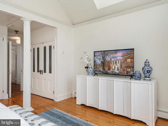 143 Market St, Annapolis, MD 21401 - interior space featuring a baseboard heating unit, decorative columns, and hardwood / wood-style floors