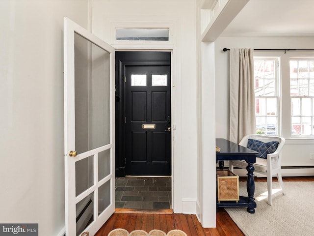 foyer entrance with dark hardwood / wood-style floors