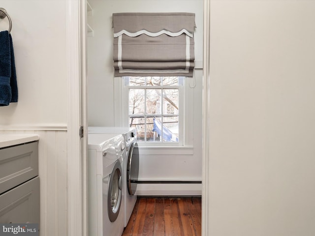 143 Market St, Annapolis, MD 21401 - washroom with a baseboard heating unit, dark wood-type flooring, and washing machine and dryer