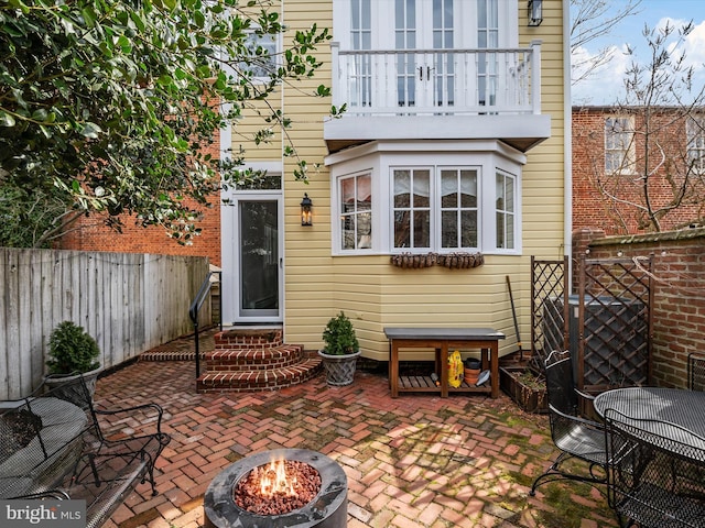 143 Market St, Annapolis, MD 21401 - rear view of property with a patio, a balcony, and an outdoor fire pit