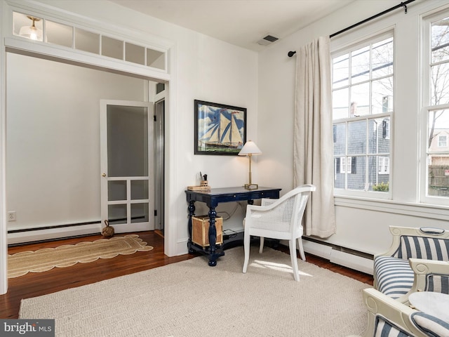 143 Market St, Annapolis, MD 21401 - home office featuring a baseboard heating unit and dark hardwood / wood-style floors