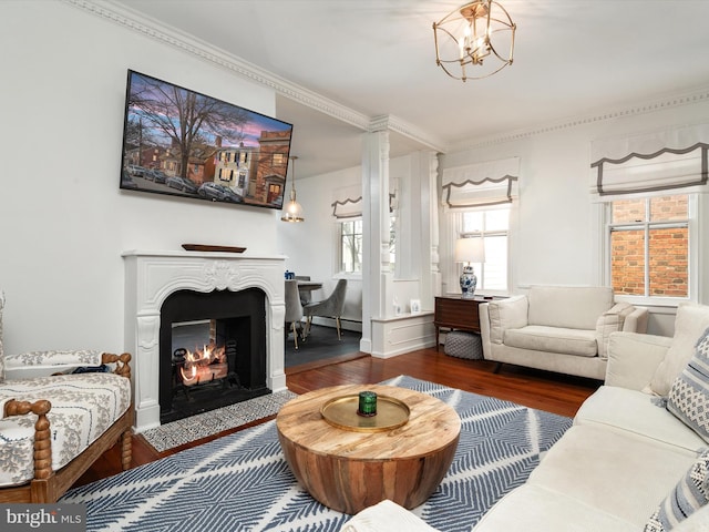 143 Market St, Annapolis, MD 21401 - living room featuring dark hardwood / wood-style flooring, crown molding, and an inviting chandelier