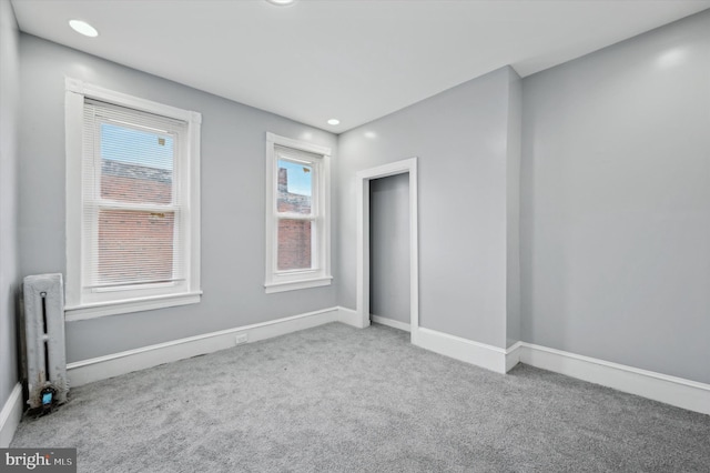 empty room featuring light colored carpet