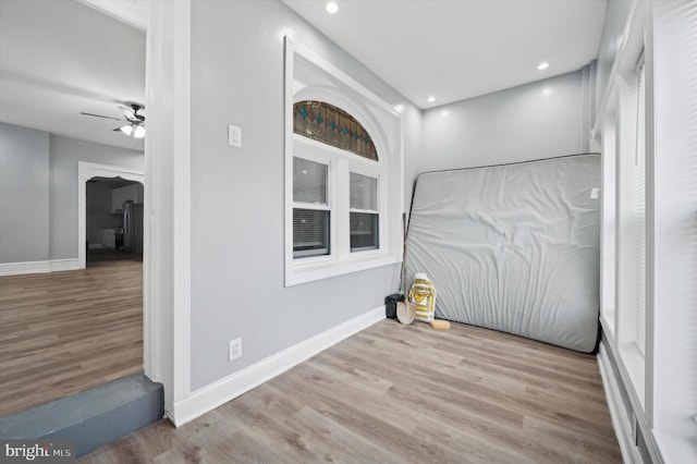 interior space featuring light hardwood / wood-style floors and ceiling fan