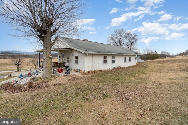 view of home's exterior with a yard