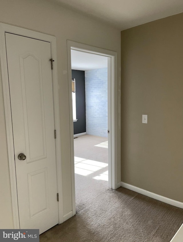 hallway with carpet flooring