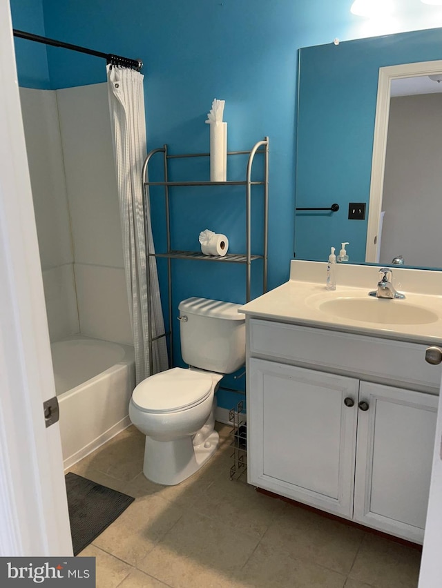 full bathroom featuring tile patterned flooring, vanity, shower / tub combo, and toilet