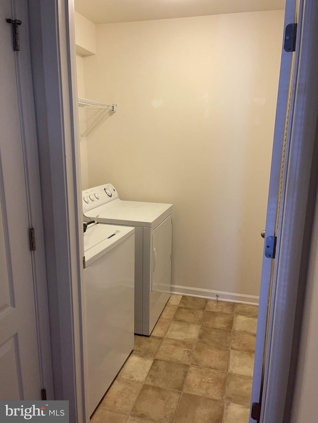 washroom featuring independent washer and dryer