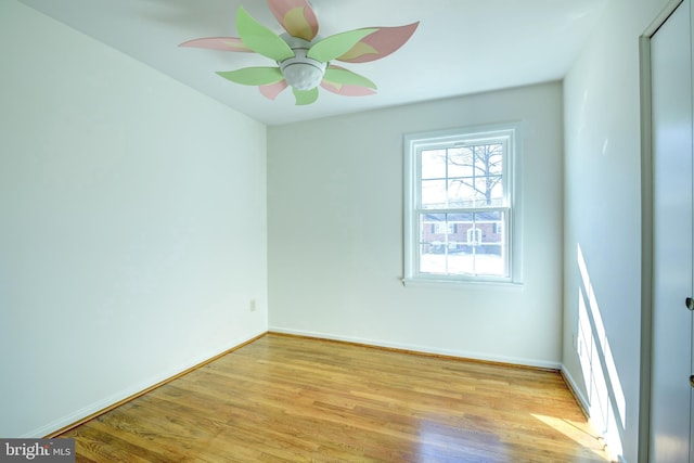 empty room featuring light wood-type flooring and ceiling fan