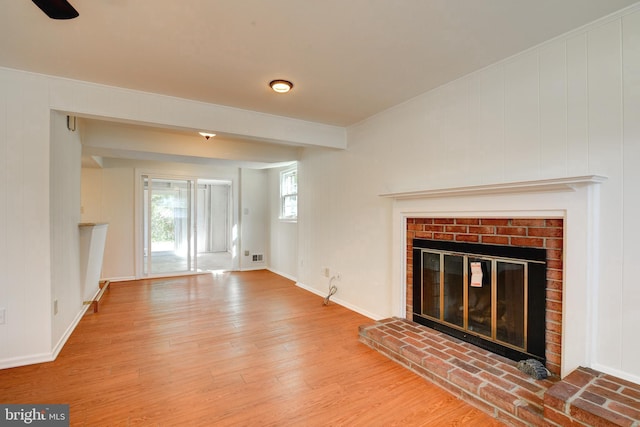 unfurnished living room with a fireplace and hardwood / wood-style floors