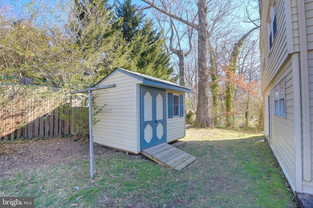 view of outbuilding featuring a yard