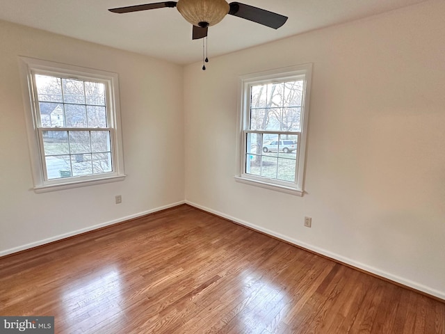 unfurnished room with ceiling fan and light hardwood / wood-style floors