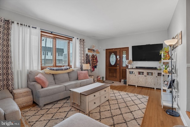 living room with light hardwood / wood-style floors