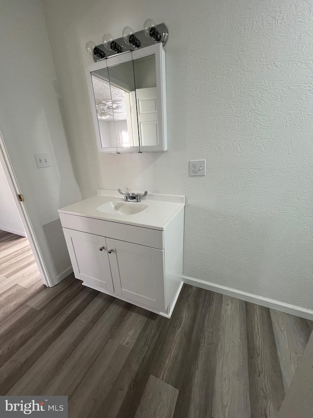 bathroom featuring vanity and hardwood / wood-style floors