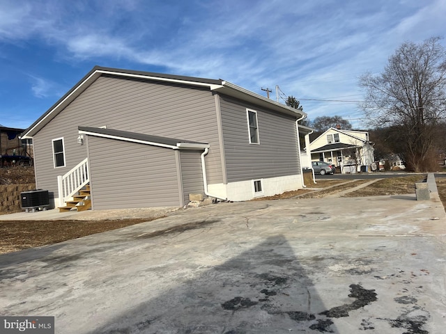 view of home's exterior featuring cooling unit